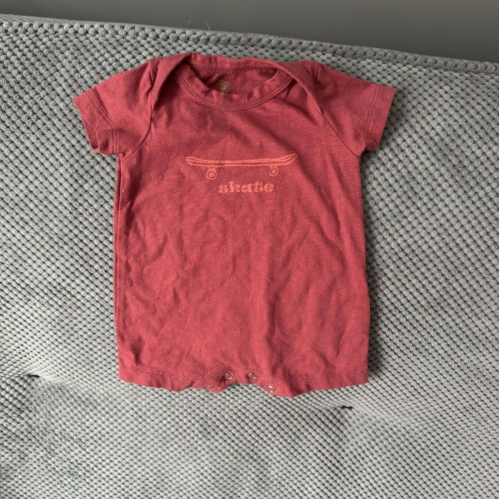 Kate Quinn Organic Cotton “Skate” Onesie 0-3M